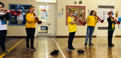 Pupils at Coit Primary School play the pBugle