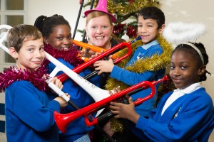 Xmas music. The children from Frederick Bird Primary school, Coventry, have been learning how to play the P instruments. Pictured, from left, Korey Palmer(8), Christiana Ojo (9), Becca Pope from Warwick Music Group, Lukas Taragos (8), Wonder Ehouman (8)