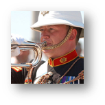 A brass player playing the bugle.