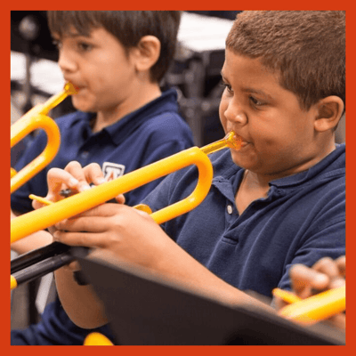 Children playing pTrumpets in concert.