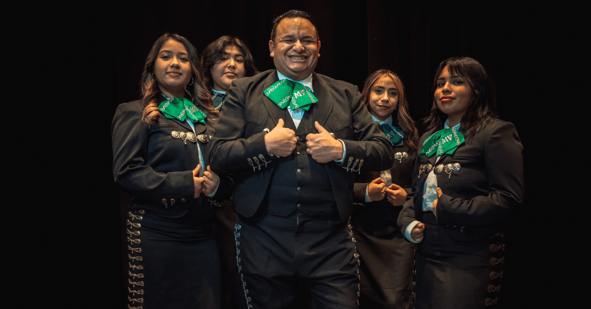 Ramón Rivera with a group of Mariachi students.